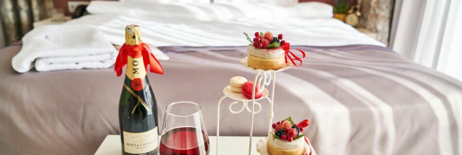 photo of wine bottle and food on table