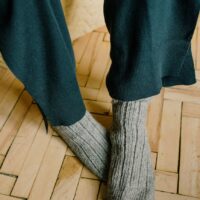 gray socks on wooden floor