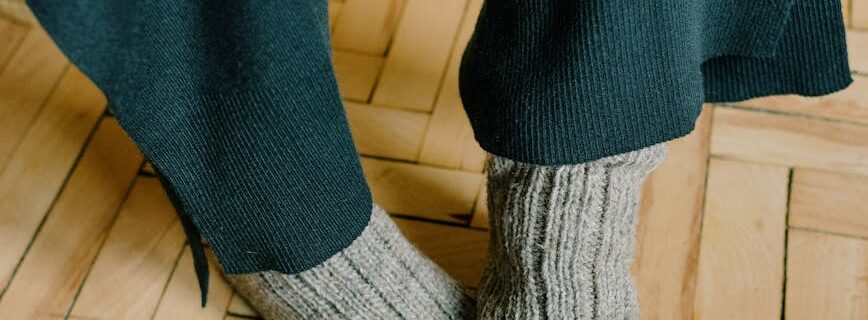 gray socks on wooden floor