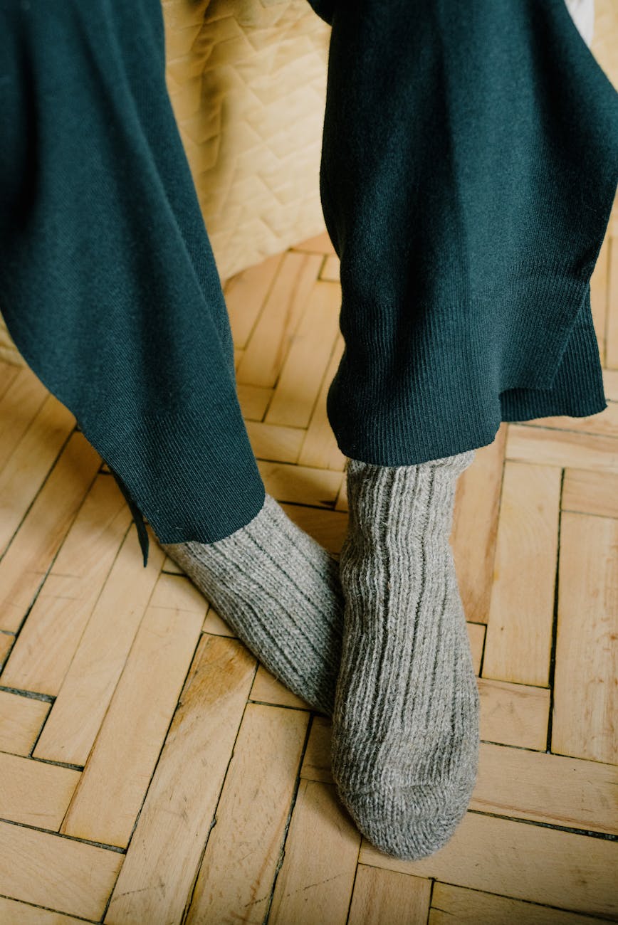 gray socks on wooden floor