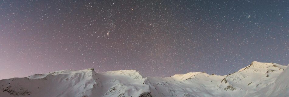 mountain covered snow under star