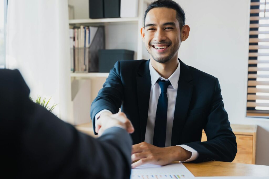 successful negotiate and handshake concept two businessman shake hand with partner to celebration partnership and teamwork business deal