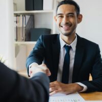 successful negotiate and handshake concept two businessman shake hand with partner to celebration partnership and teamwork business deal