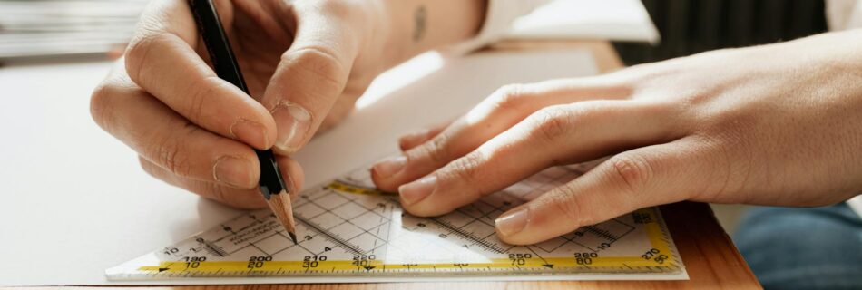 person writing on white paper
