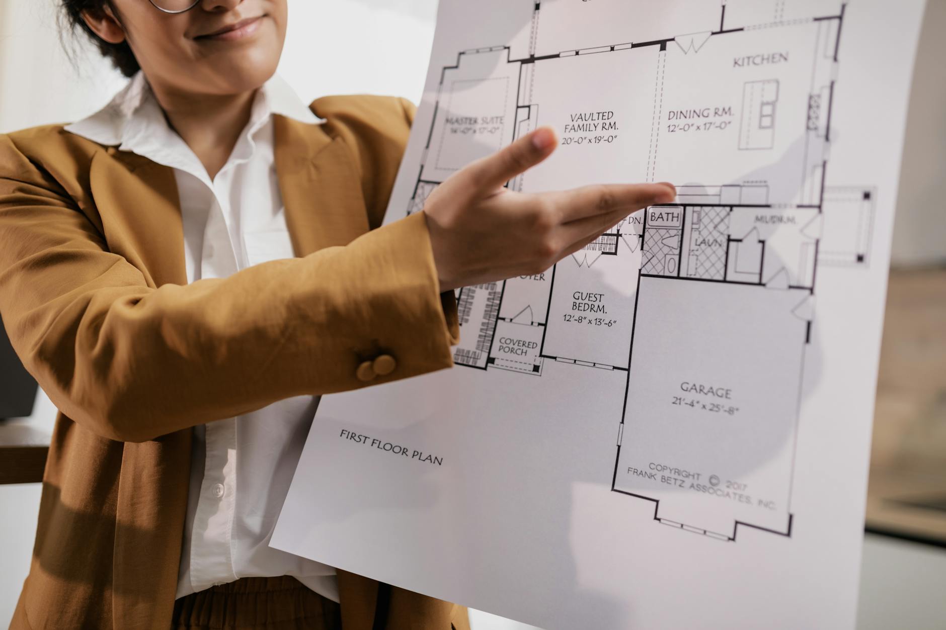 a realtor presenting a blueprint