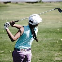 woman playing golf