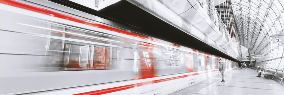 blurred motion of illuminated railroad station in city