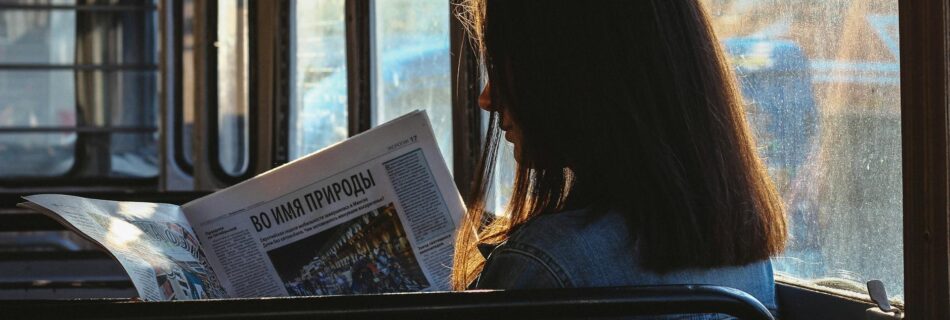 woman reading newspaper