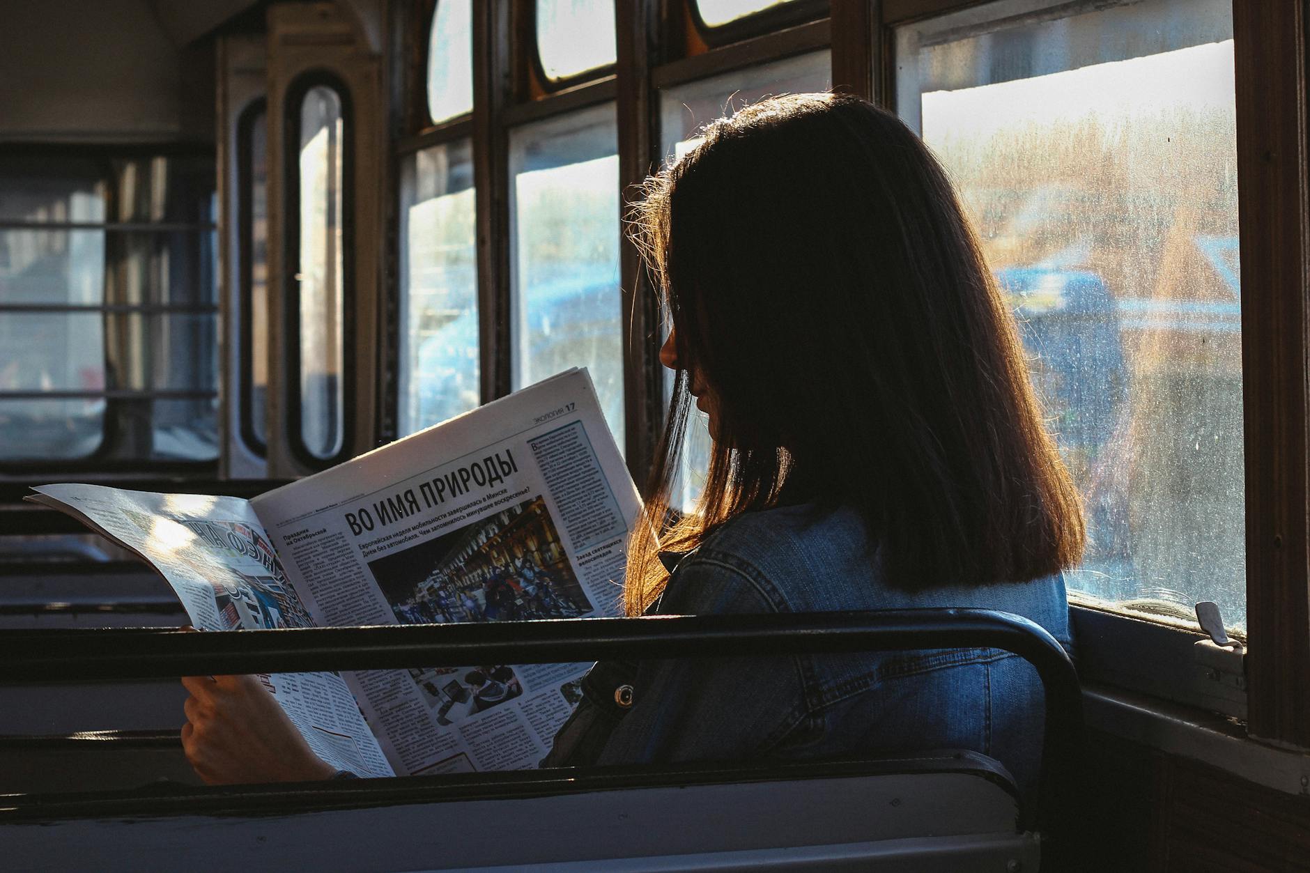 woman reading newspaper