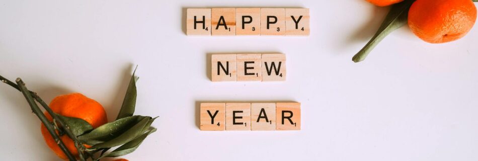 letter tiles beside mandarins