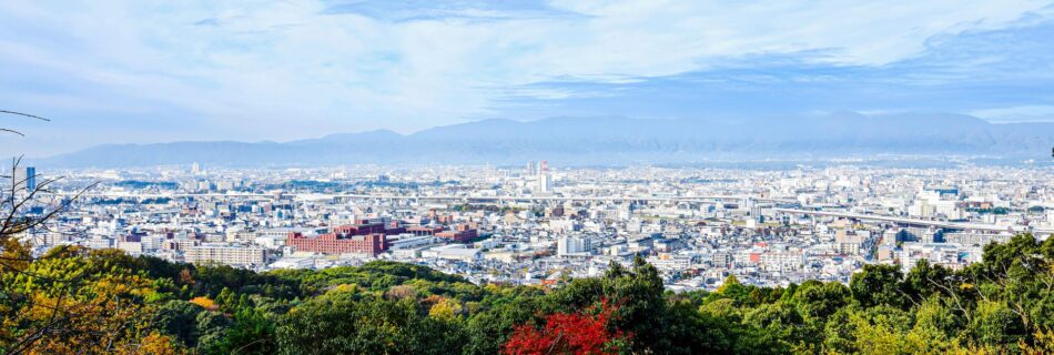 cityscape of kyoto seen from the fushimi inari shrine